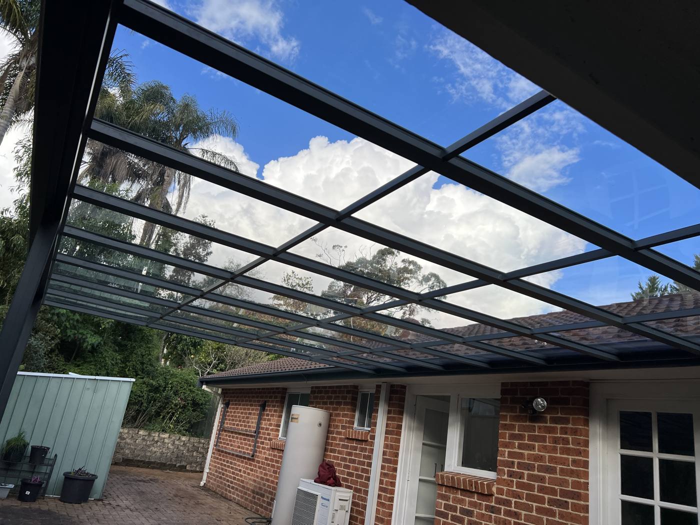 Clear Polycarbonate Patio Roof installation Sydney — Sword Sky outdoor structure installer