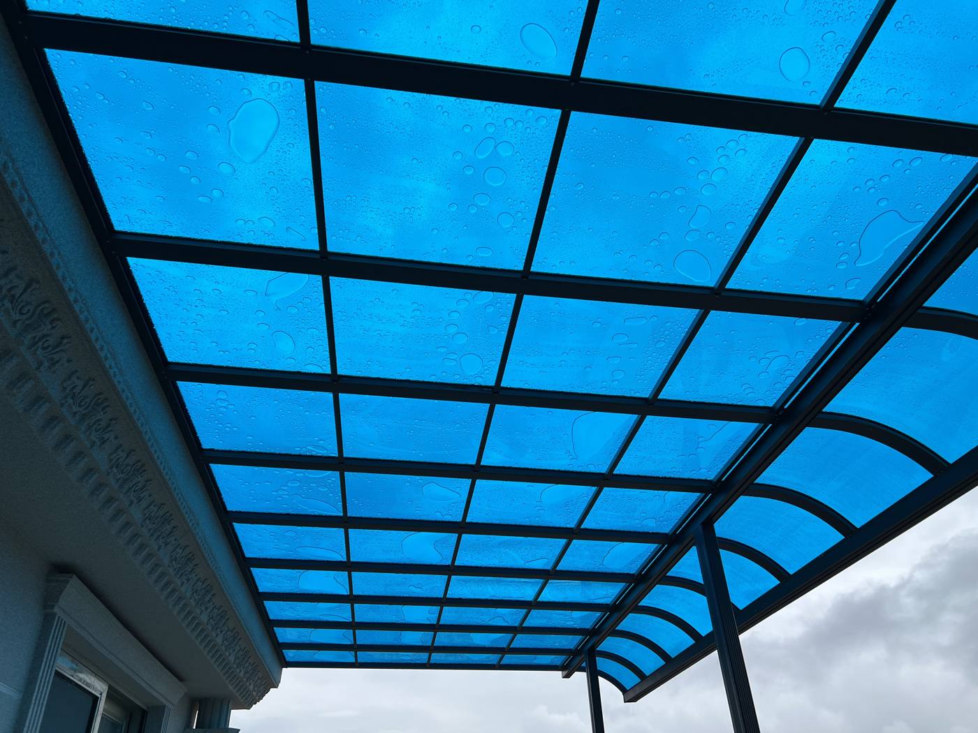 Curved Polycarbonate Patio Awning installation Sydney — Sword Sky outdoor structure installer