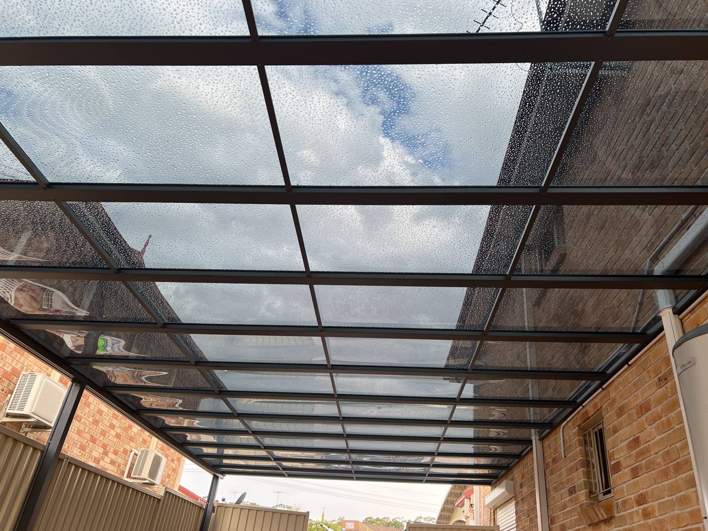 Polycarbonate Roof Side Passage installation Sydney — Sword Sky outdoor structure installer