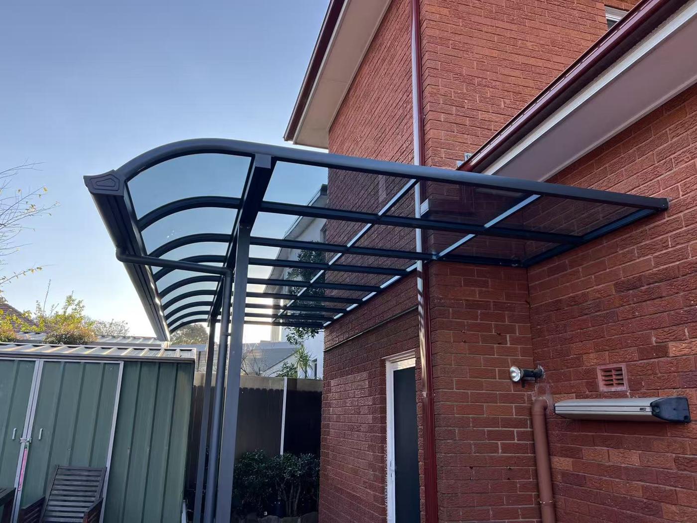 Curved Polycarbonate Side Awning installation Sydney — Sword Sky outdoor structure installer