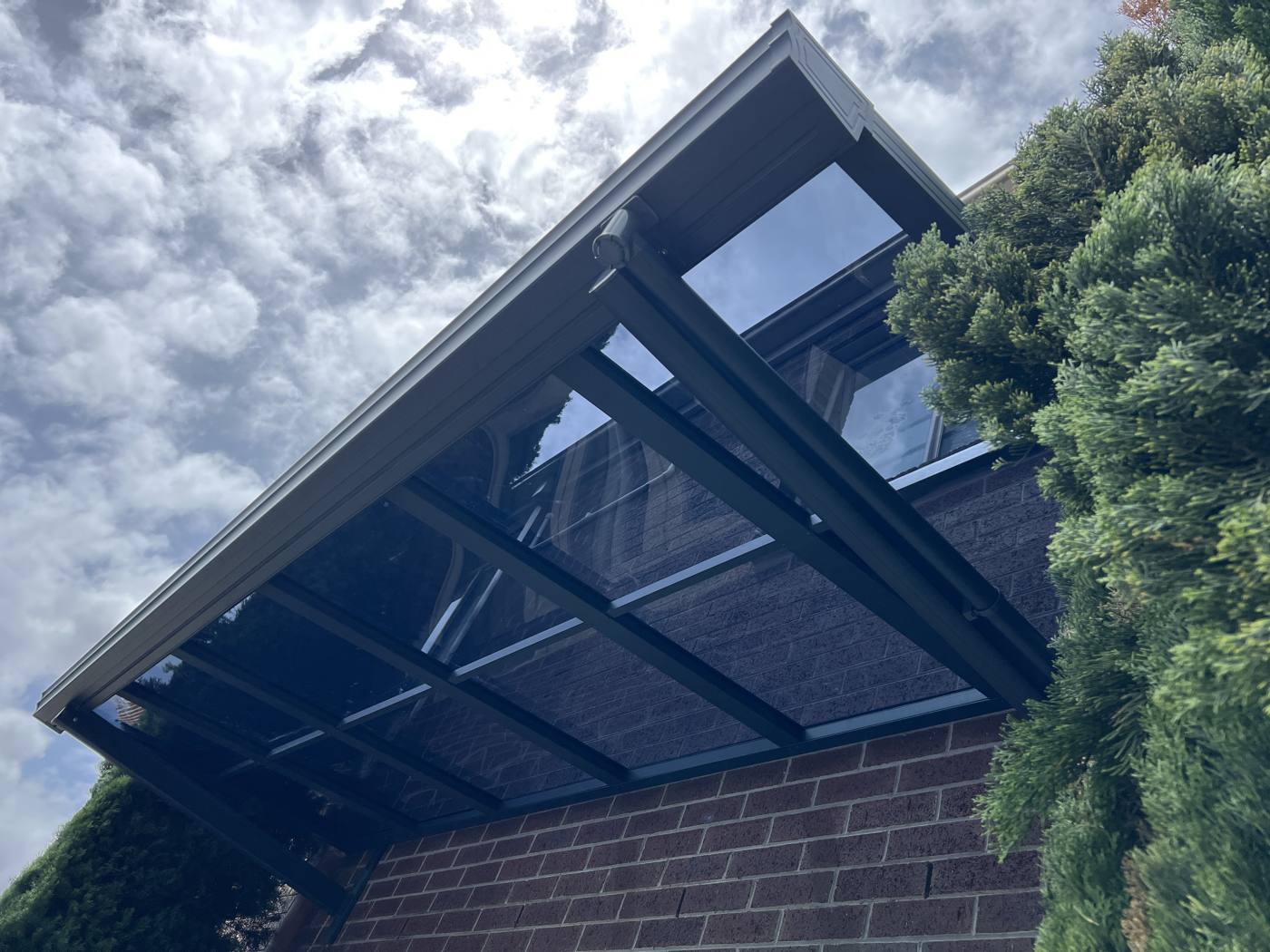 Wall-Mounted Polycarbonate Awning installation Sydney — Sword Sky outdoor structure installer