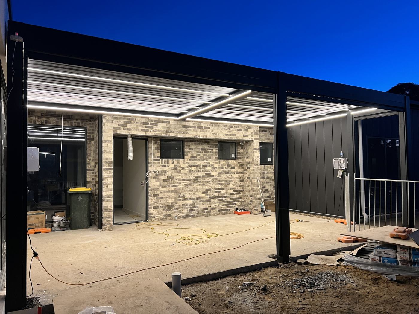 Black Louvre Pergola with LEDs installation Sydney — Sword Sky outdoor structure installer
