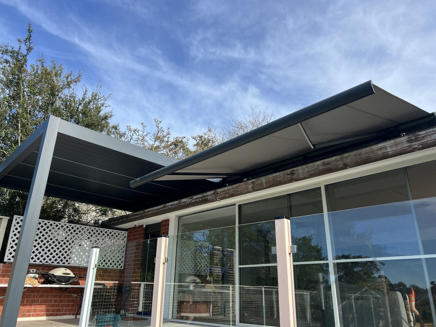 Louvre Pergola with Folding-Arm Awning installation Sydney — Sword Sky outdoor structure installer