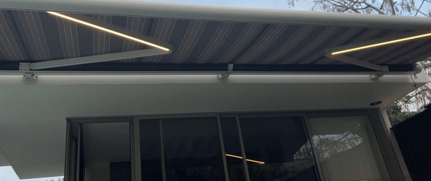 Folding-Arm Awning with LED Arms installation Sydney — Sword Sky outdoor structure installer